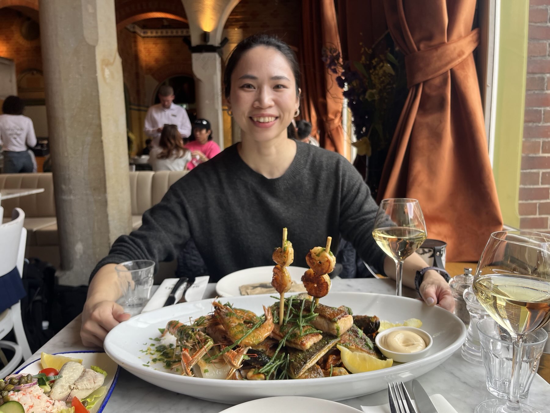 Spring at a restaurant table with a grilled seafood platter