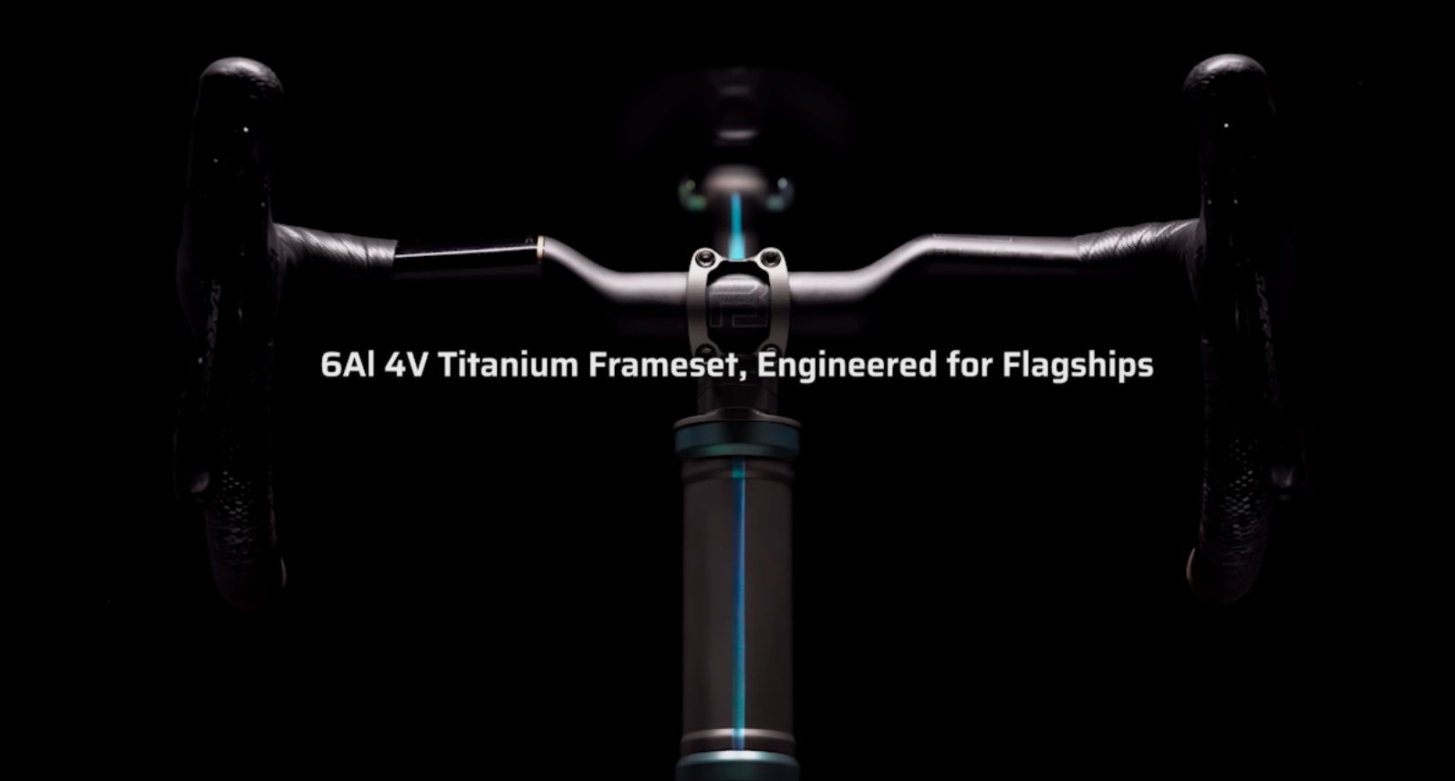 A titanium bicycle cockpit lit against a black background, with the line “6Al 4V Titanium Frameset, Engineered for Flagships”